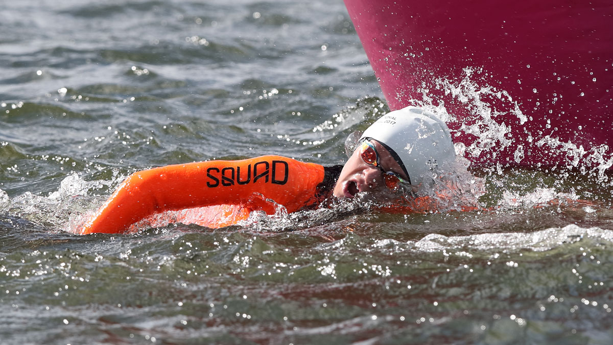 Boy swimming in open water